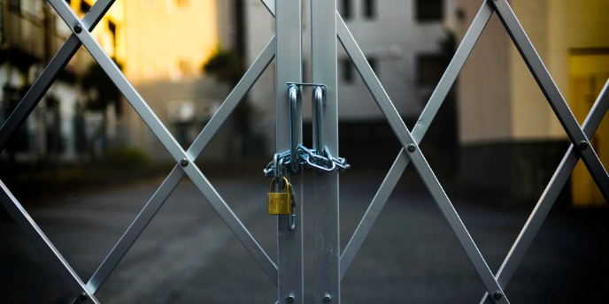 gate of an industrial park closed with a padlock