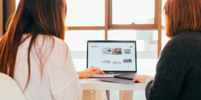 two women using a computer
