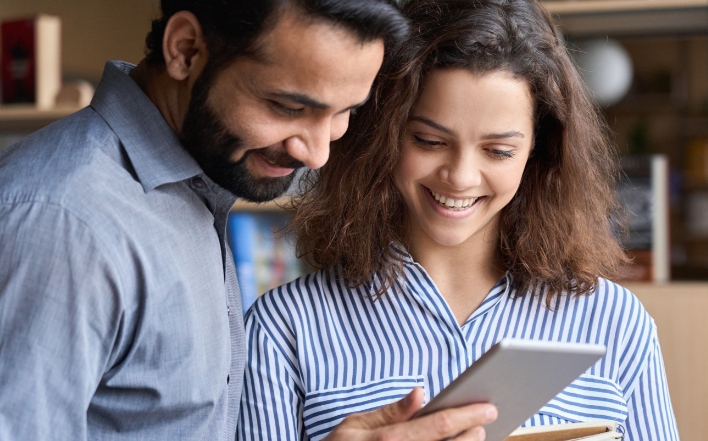 happy customers using a tablet