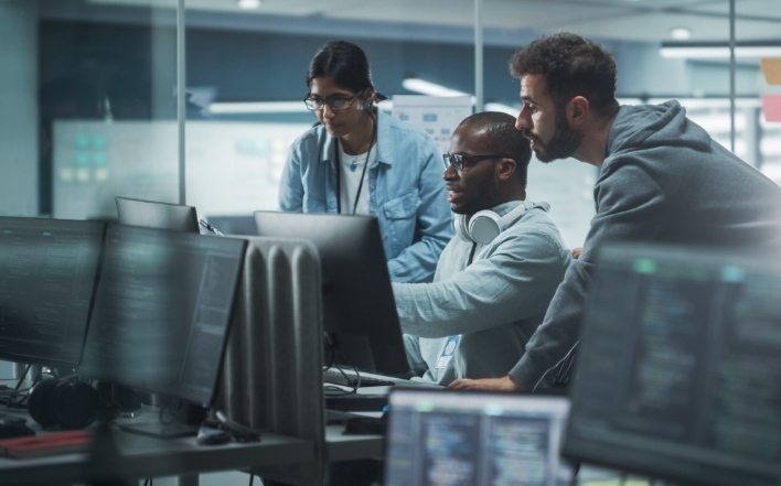 IT professionals busy working on a solution