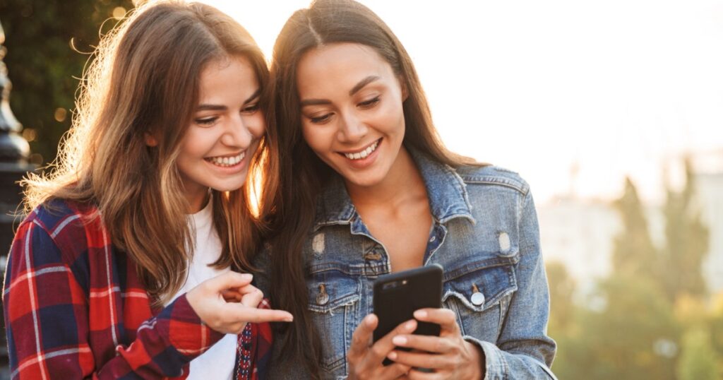 women making a secure payment using a mobile