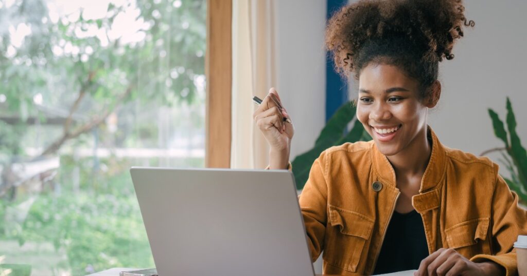 female student studying online on a laptop